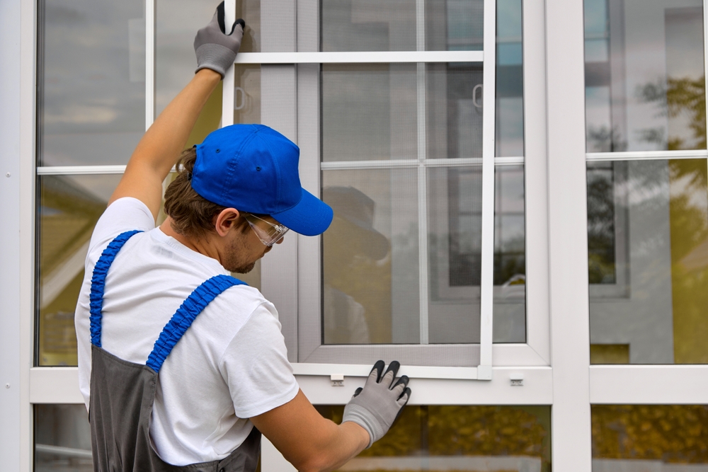 Worker installing replacement window